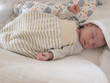 © Alexander - newborn baby sleeping peacefully in a sleeping bag