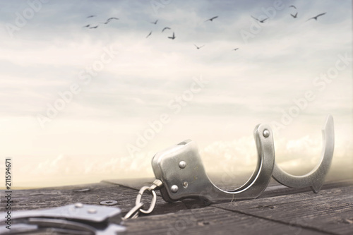 freedom concept with a pair of open handcuffs Poster Mural XXL
