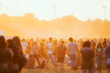 Sunset at summer music festival, blurred crowd during concert