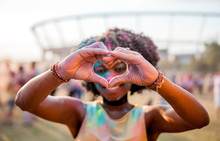 Beautiful African American Girl At Summer Holi Festival Make Heart Symbol By Hands