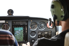 Closeup Of A Cockpit Of Cessna Skyhawk 172 Airplane With Two Pilots.