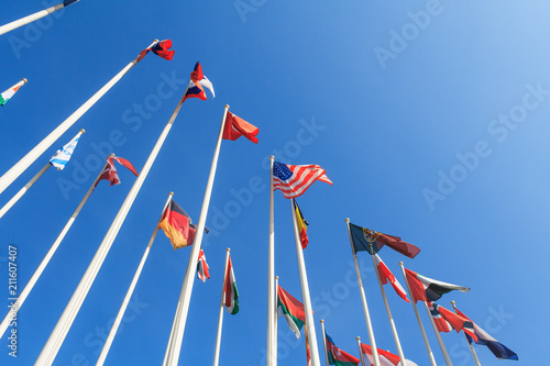 Cuadros en Lienzo Bottom view of a rows of flags of different countries of the world, flutters in