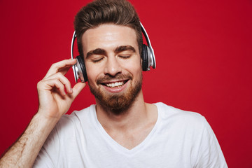 Wall Mural - Handsome emotional young man listening music