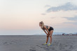© LStockStudio - Woman Jogging on Sandy Beach