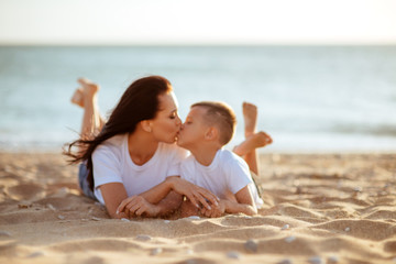 blured mother and son on the beach