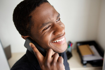 Wall Mural - happy african american man talking on cellphone