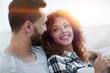 © ASDF - loving couple sitting on a sofa in the living room