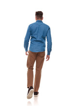 Back View Of Young Man In Casual Clothes Walking