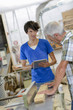 © auremar - Carpenters using a tablet computer