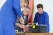 © auremar - Apprentices learning to fit door mechanism