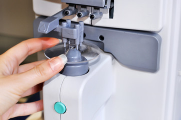 Sticker - Health care, medicine and vision concept.Professional ophthalmology instrument in clinic office and optics.Optician measuring and preparing glasses,raw material
