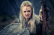 Mad furious viking woman warrior in the attack. Sward and shield. Close-up portrait. Book Cover