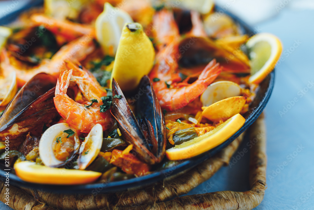spanish seafood paella, closeup view - obrazy, fototapety, plakaty 