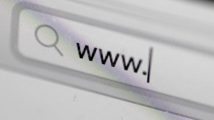 Text WWW in browser on monitor computer screen and flashing bar, macro shot