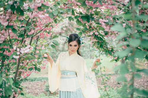 A Girl With Long Black Hair Decorated With Kandzashi Flowers And