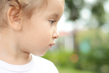 Portrait of baby girl in park.