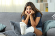 © Antonioguillem - Frustrated disabled woman with plaster foot looking at you