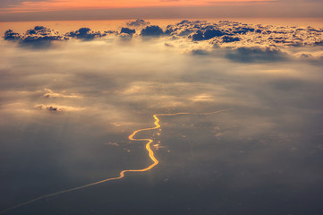 Wall Mural - Golden river under cloud