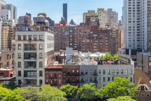 New York City - Overhead View Of Historic Buildings Along 59th Street With The Midtown Manhattan Skyline In The Background