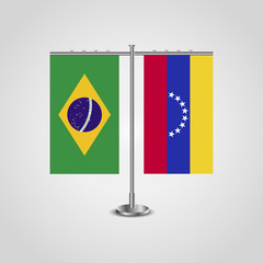 Table stand with flags of Brazil and Venezuela.Two flag. Flag pole. Symbolizing the cooperation between the two countries. Table flags