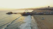 Aerial Shot Moving Towards Santa Monica Pier In California And Then To The Beach