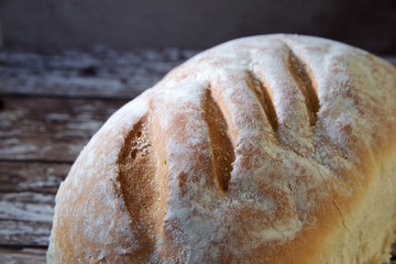 Loaf of bread on wooden board