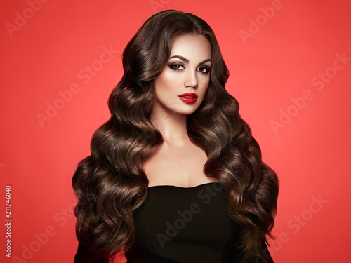 Brunette Girl With Long Healthy And Shiny Curly Hair Care And