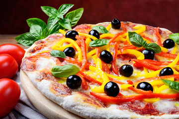 Wall Mural - Pizza with tomato, mozzarella, peppers, olives, extra virgin and basil