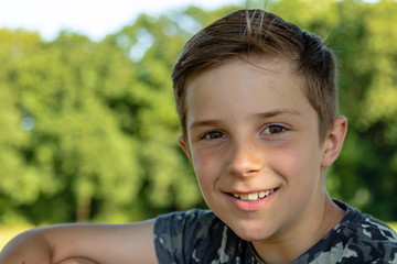 pre-teen caucasian boy playing outside