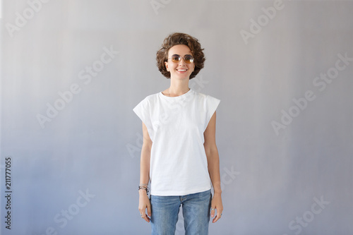 Portrait Of Young Pretty Student Girl With Short Curly