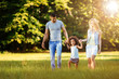 © NDABCREATIVITY - Happy young couple spending time with their daughter