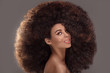 © neonshot - Beauty portrait of attractive woman in afro hairstyle.
