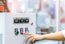 Engineer's Hand Push Red Button To Shutdown Temperature Control Machine. Temperature Control Panel Cabinet Contain Digital Screen Display For Temperature Gauge. Heat Control In Industrial Factory.