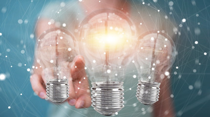 Poster - Businesswoman connecting modern lightbulbs with connections 3D rendering