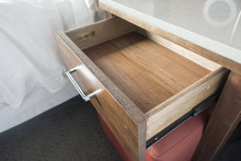 Close Up Of Open Bedside Wooden Drawer