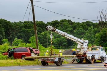 Sayreville NJ USA - Jujy 02, 2018: Red car after the terrible accident - it crashed into Replacing the electric pillar