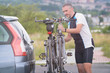 © Monika Wisniewska - Man loading bicycles on the bike rack