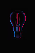 Ideas And Innovation Red And Blue Light Bulb Concept