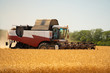 Combine harvester for harvesting wheat. 