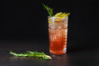 © OlehZlotov - Alcoholic cocktail decorated with an apple and a sprig of rosemary