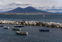 Day View Of Mount Vesuvius, The Active Volcano, Seen From The Gulf Of Napoli With Buildings Ashore, Naples, Campania