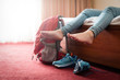 © PAstudio - Happy tired traveller lies on the bed high quality hotel.