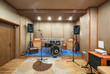 Sound studio room with drum kit.