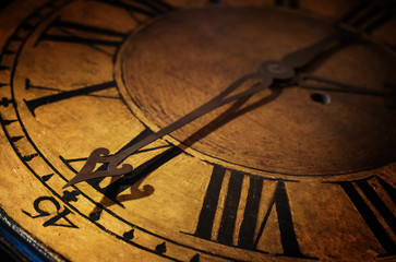 Close up old antique classic clock. Concept of time, history, science, memory, information. Retro style. Vintage background.