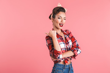 Poster - Portrait of a playful beautiful brunette pin-up woman