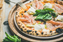 Italian Lunch Or Dinner. Freshly Baked Pizza With Artichokes, Smoked Turkey Ham, Olives, Cream Cheese And Basil Over Rustic Wooden Background, Selective Focus, Horizontal Composition