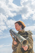 © dmitrypk - girl in uniform with a Bazooka
