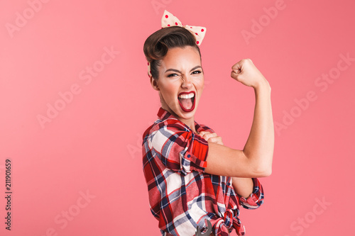 Fotografía Gorgeous strong young pin-up woman showing biceps.