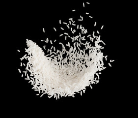 Stop motion white rice splash or explode flying in the air  isolated on black background food object design