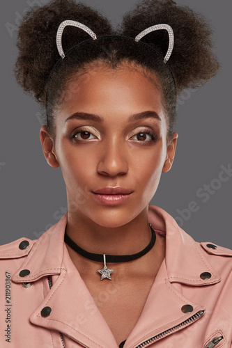 A Close Up Portrait Of A Young African Lady In A Jacket